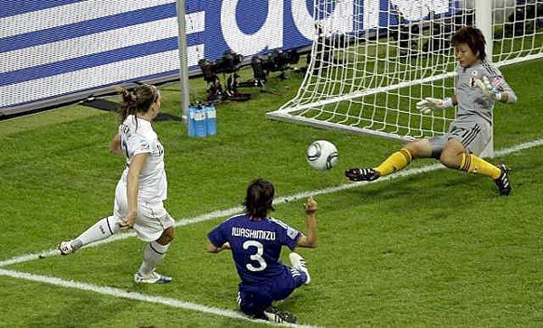 Japan goalkeeper Ayumi Kaihori deflects a shot by American Lauren Cheney, left, during the Women's World Cup final on Sunday in Frankfurt, Germany.