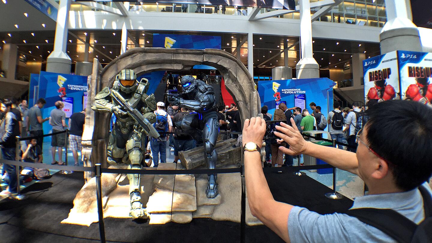 A man records a display for "Halo 5: Guardians" during the first day of E3 at the L.A. Convention Center.