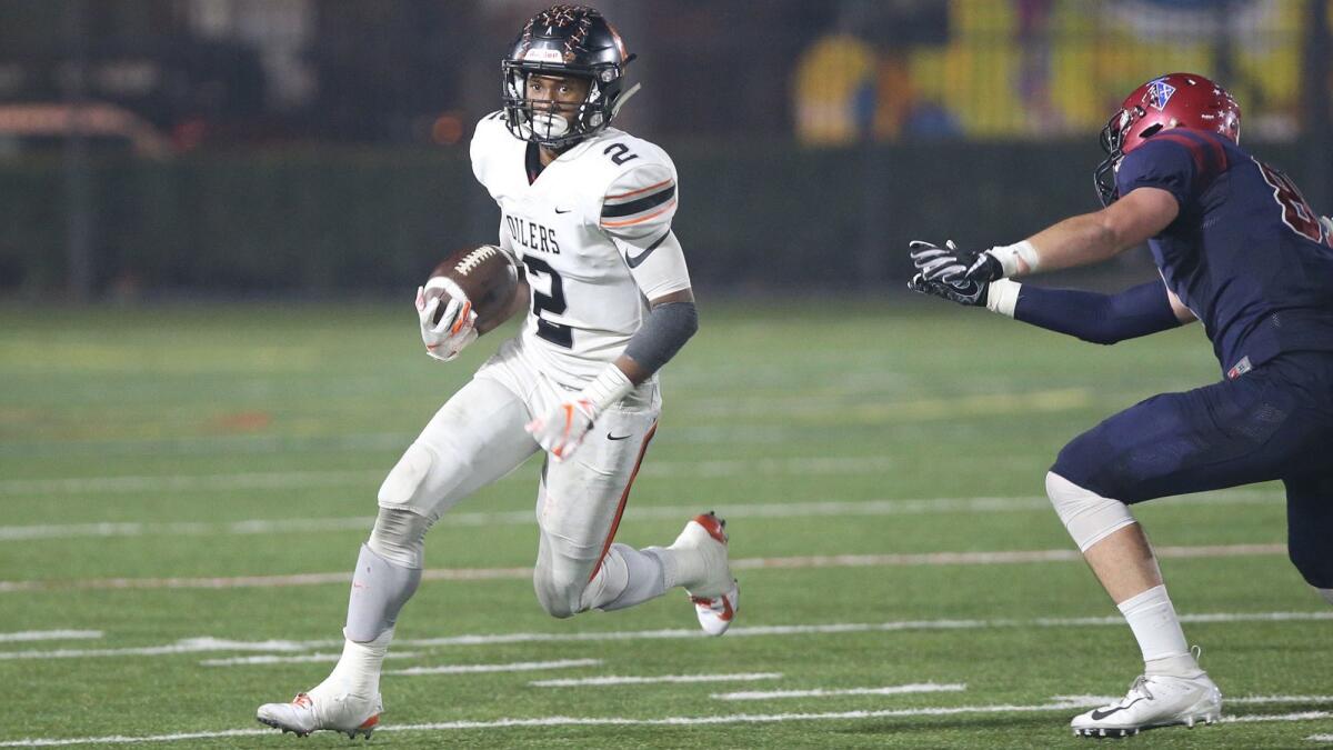 Huntington Beach High running back Arick McLawyer, pictured running the ball at St. Margaret's on Nov. 3, 2018, had six catches for 47 yards a touchdown in the South's 16-7 win over the North in the Orange County All-Star Classic on Saturday.