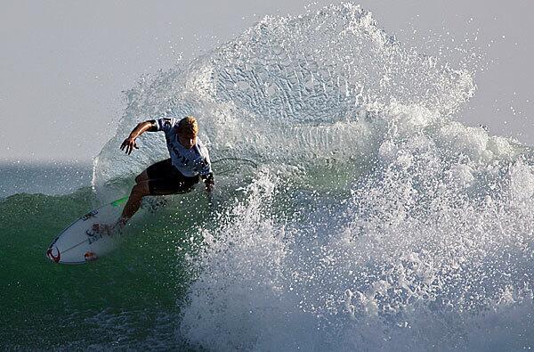 Mick Fanning catches a wave in the finals of the Assn. of Surfing Professionals' Hurley Pro event at Low Trestles, near San Clemente, Calif.