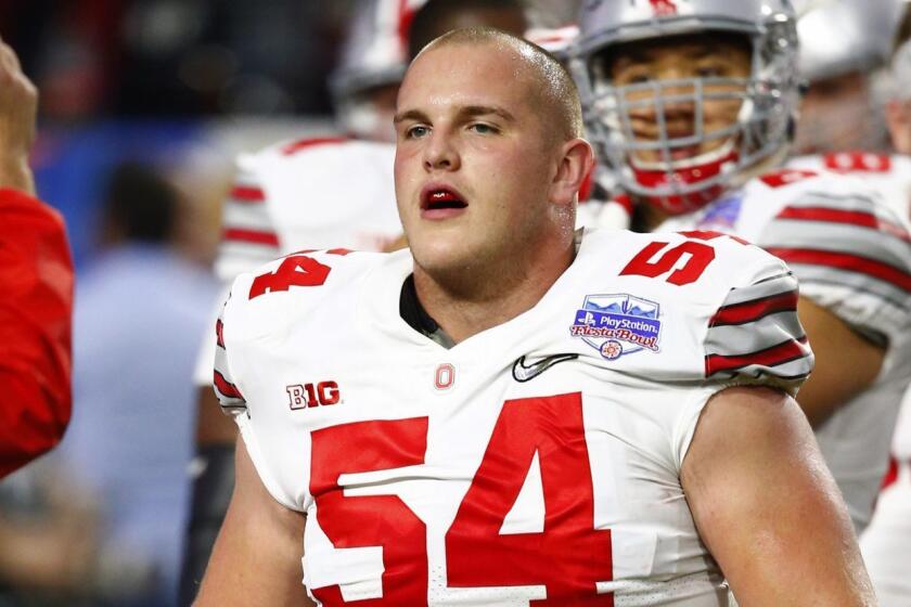 FILE - In this Dec. 31, 2016, file photo, Ohio State offensive lineman Billy Price (54) warms up prior to the Fiesta Bowl NCAA college football game against Clemson, in Glendale, Ariz. The old guys club at Ohio State is exclusive. All are not only at the top of the Buckeye's depth chart, they're among the best players in college football. (AP Photo/Ross D. Franklin, File)