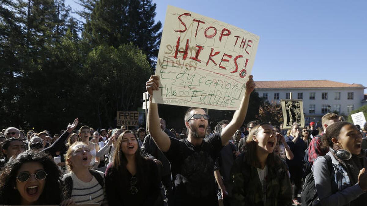 UC Berkeley student Cameron Morgan, center, protests with other students against tuition increases.