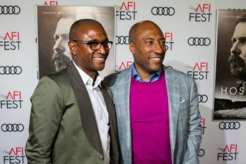 HOLLYWOOD, CA--TUESDAY, NOVEMBER 14, 2017--Actor Tommy Davidson, left and Entertainment Studios CEO Byron Allen, on the red carpet for the AFI Fest 2017 Gala Presentation of the film, "Hostiles," at TCL Chinese Theatre, in Hollywood, CA, Tuesday, Nov. 14, 2017. (Jay L. Clendenin / Los Angeles Times)