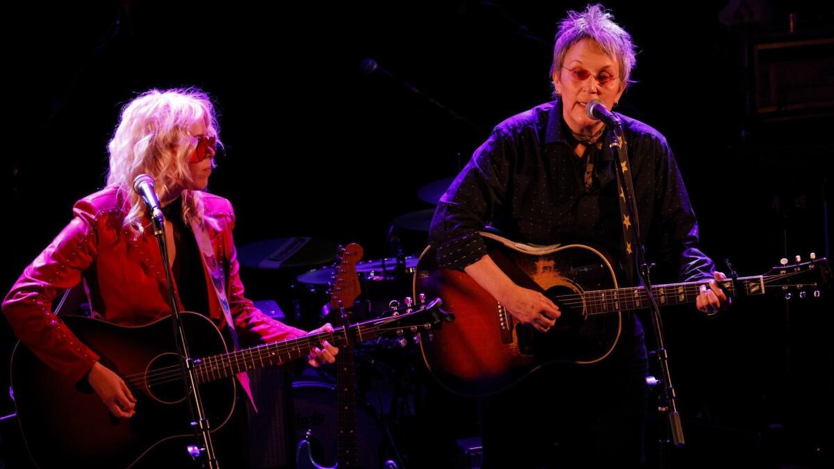 Americana musicians Jaimee Harris, left, and Mary Gauthier perform during a tribute to John Prine at The Troubadour on Saturday in West Hollywood.