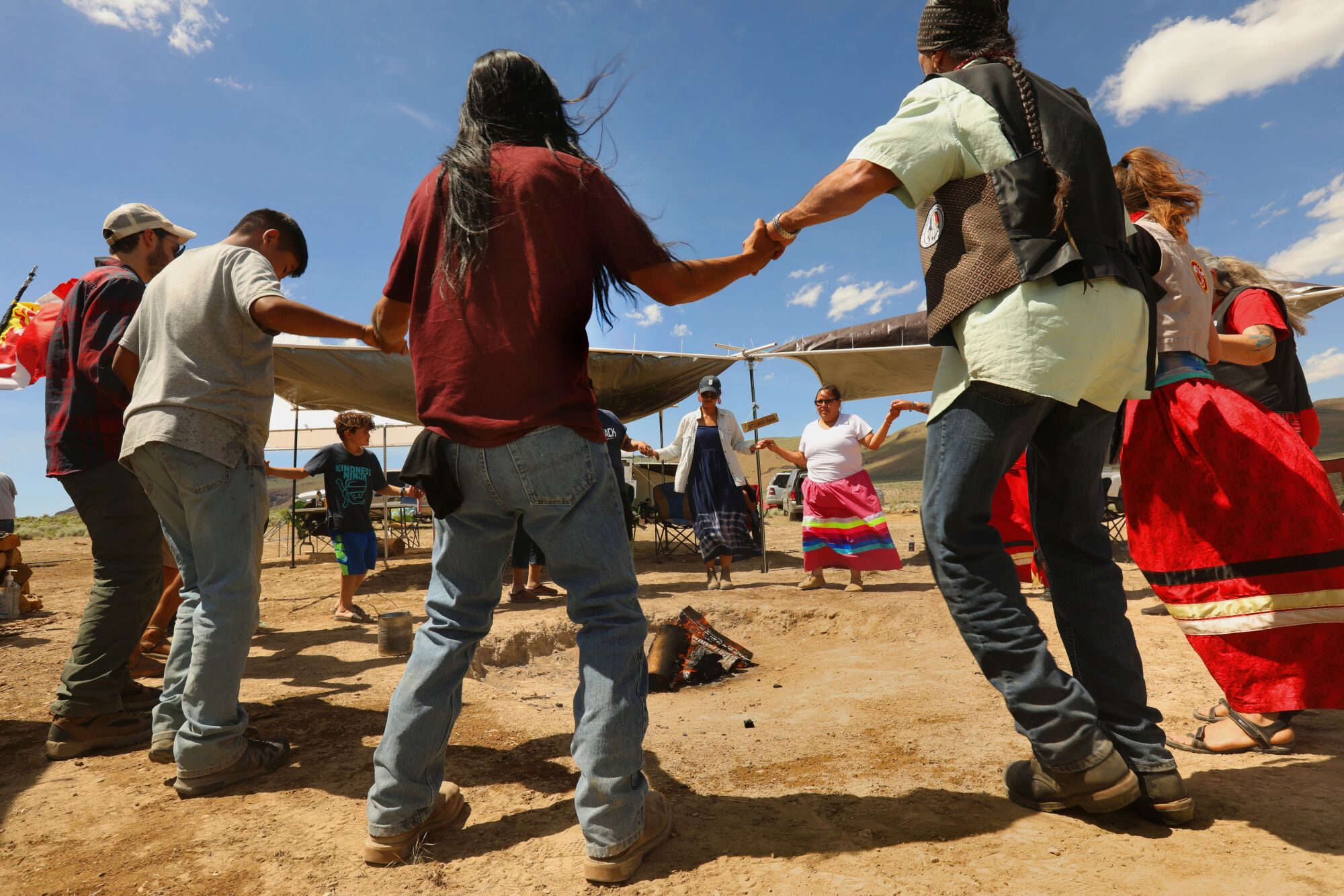 Members of the Fort McDermitt Paiute and Shoshone Tribe and supporters take part in a circle dance.
