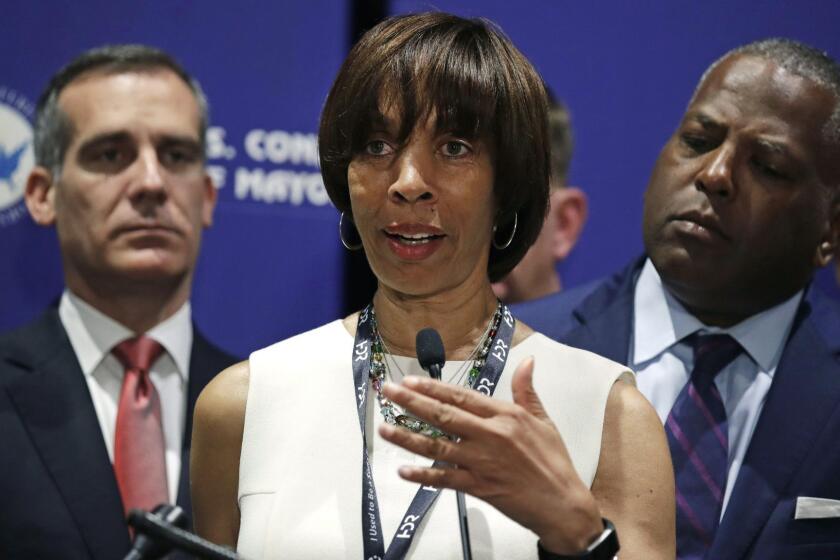 FILE - In this June 8, 2018 file photo, Baltimore Mayor Catherine Pugh addresses a gathering during the annual meeting of the U.S. Conference of Mayors in Boston. The lawyer for Baltimores mayor is making an announcement Thursday, May 2, 2019, amid growing pressure for the citys top leader to resign over a scandal involving her self-published childrens books. Pugh has been in self-imposed seclusion for a month with what attorney Steven Silverman has said is deteriorating health after a bout of pneumonia. (AP Photo/Charles Krupa, File)