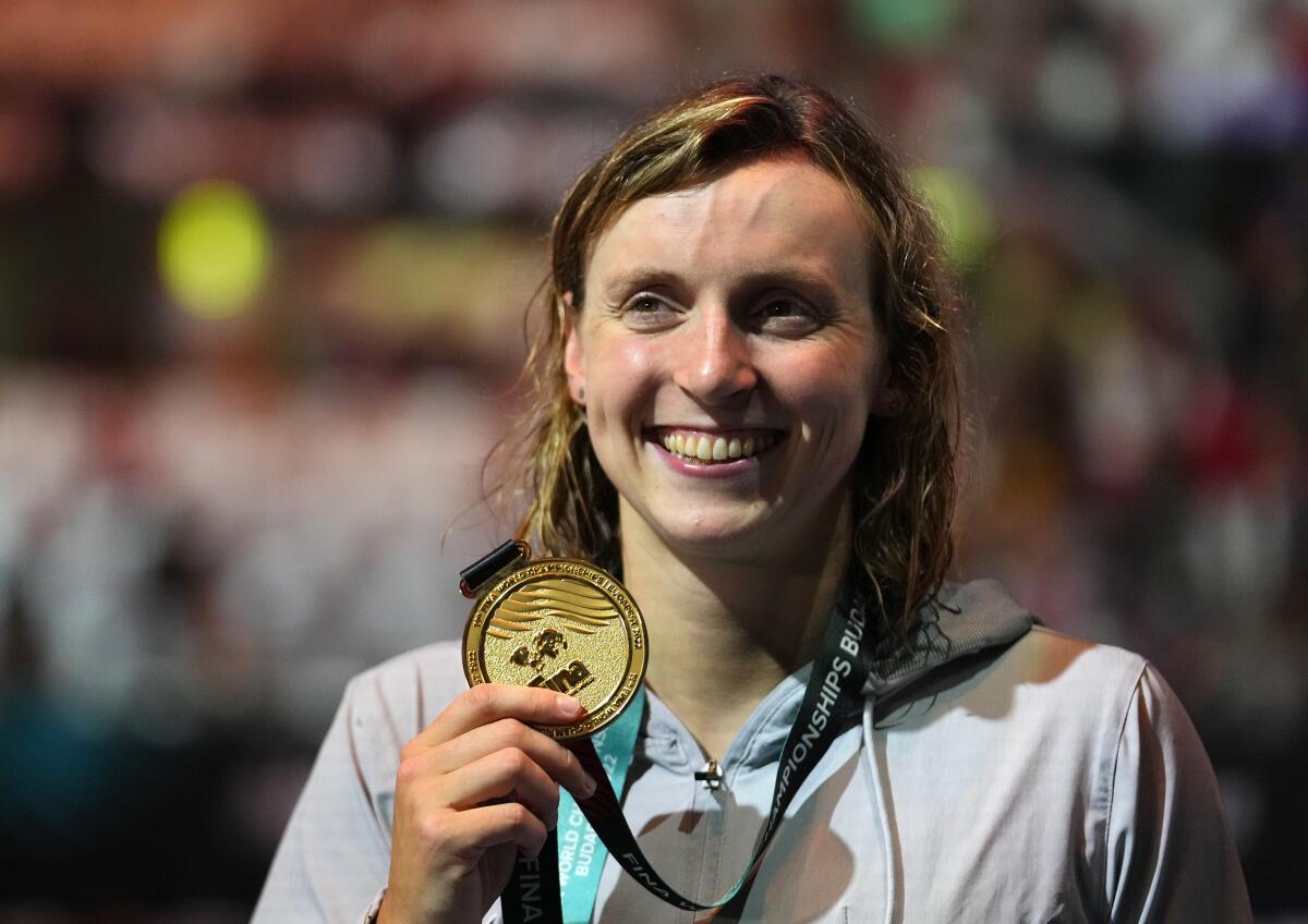 Katie Ledecky smiles after winning gold in the women's 800-meter freestyle at the FINA World Championships on Friday.