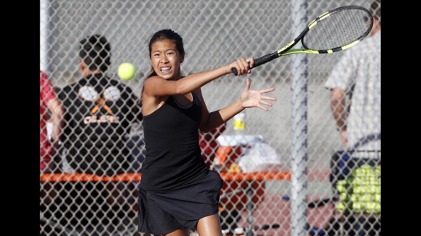 Huntington Beach High's Cindy Huynh returns a volley during a No. 3 singles set against South Pasadena in a CIF Southern Section Division 3 playoff quarterfinal match on Monday, November 5.
