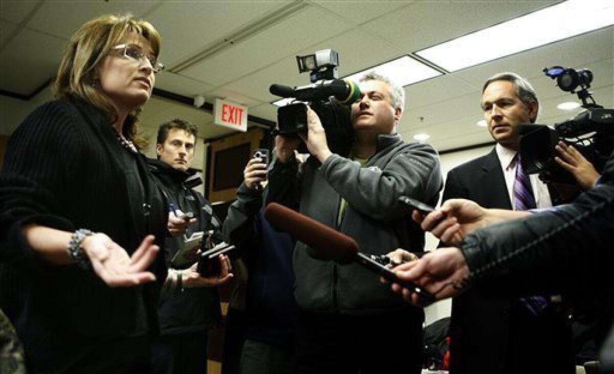 Alaska Gov. Sarah Palin, talks to media after she arrived at her office in Anchorage, Alaska on Friday, Nov. 7, 2008 for the first time since she began campaigning as Sen. John McCain's vice presidential running mate. (AP Photo/Al Grillo)