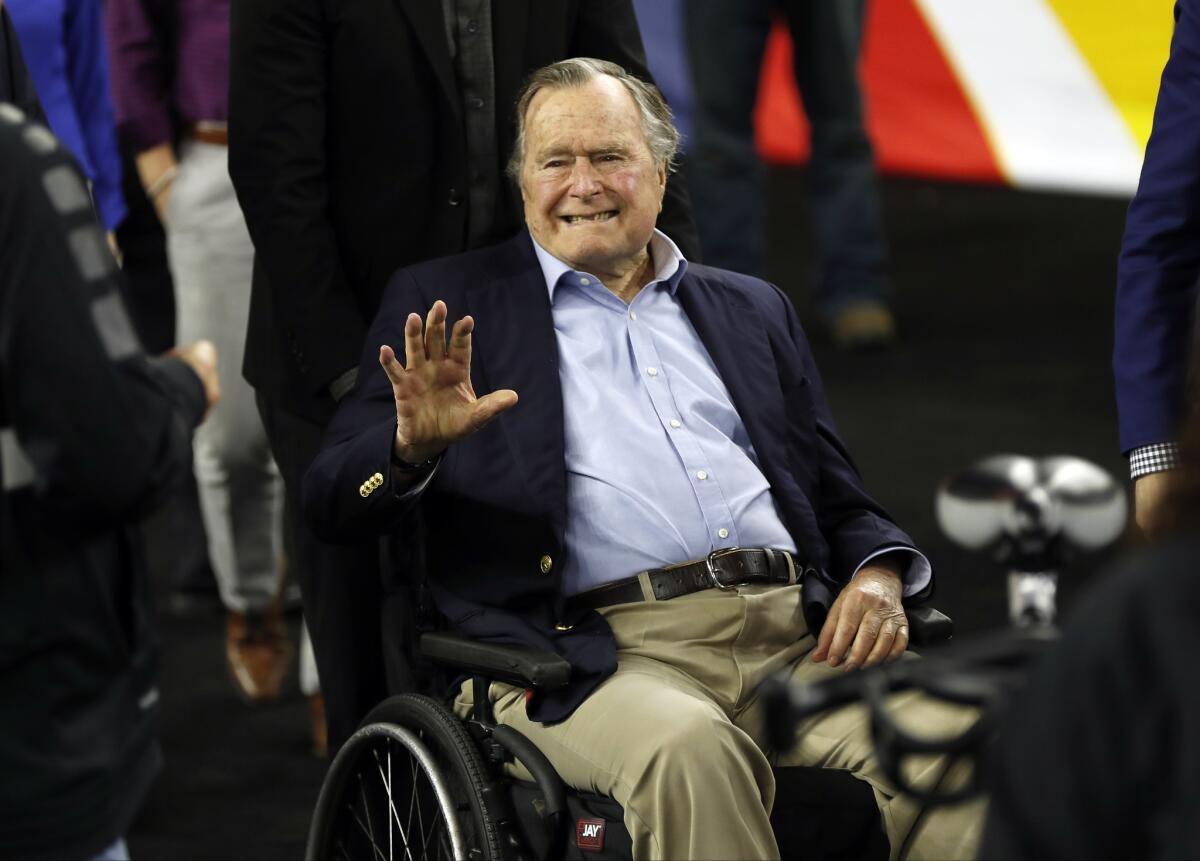 President George H.W. Bush arrives at Houston's NRG Stadium to attend the NCAA Final Four semifinals in April 2016.