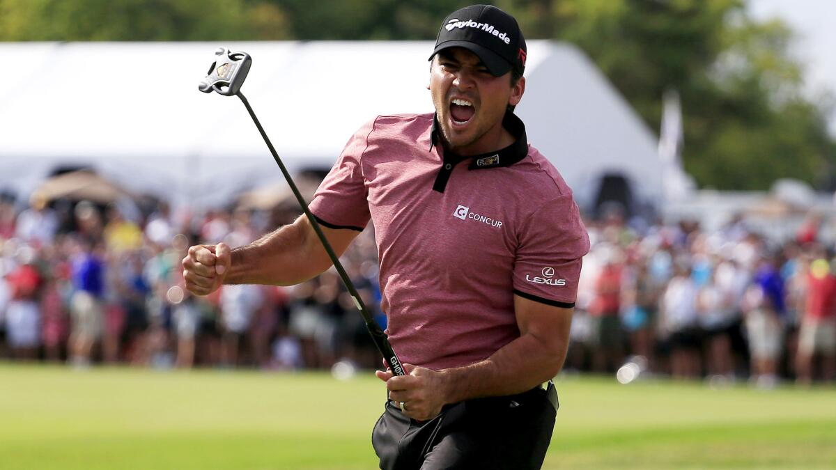 Jason Day reacts after making a birdie putt at No. 18 to win the Canadian Open on Sunday.