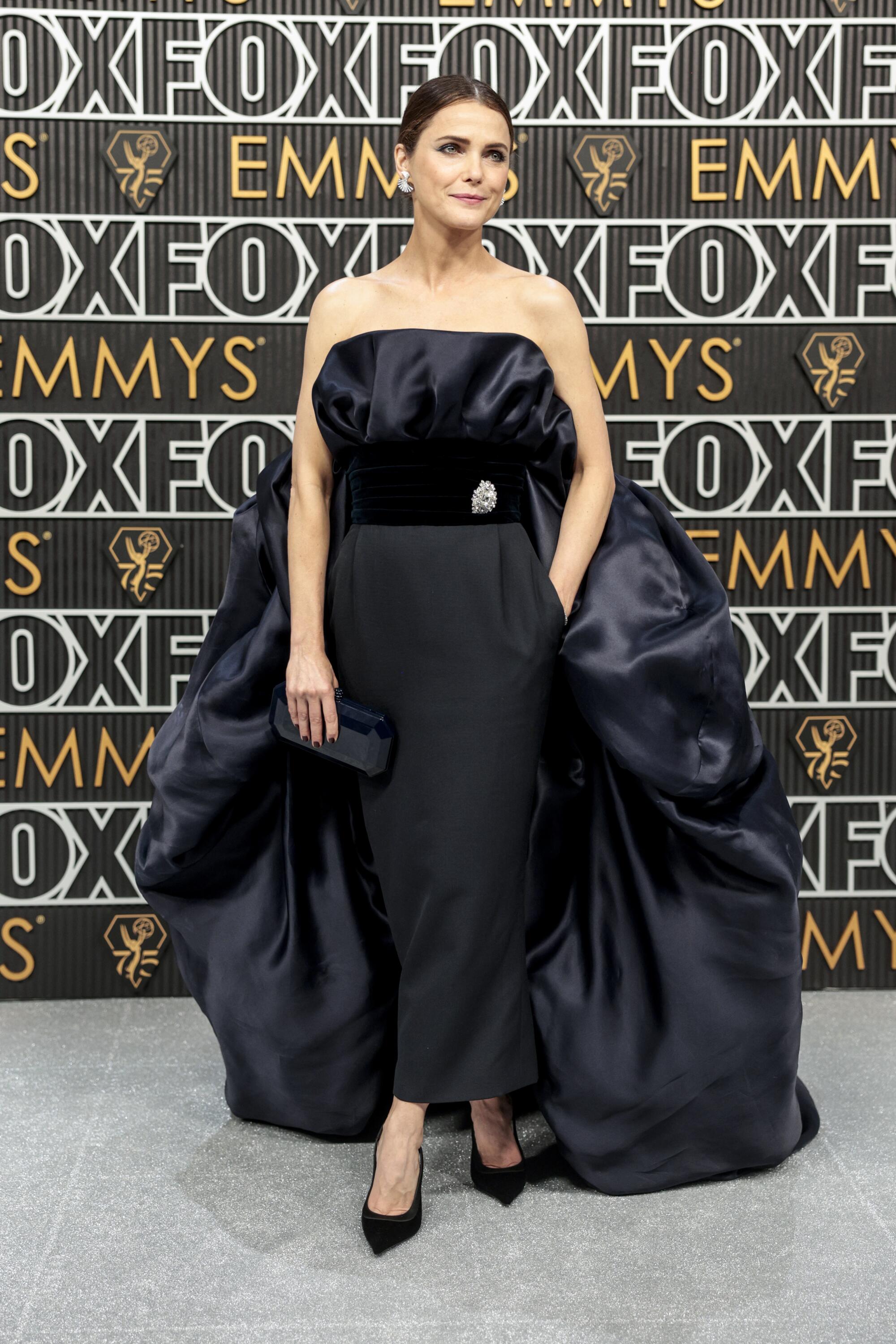 Keri Russell poses on the Emmys red carpet. 