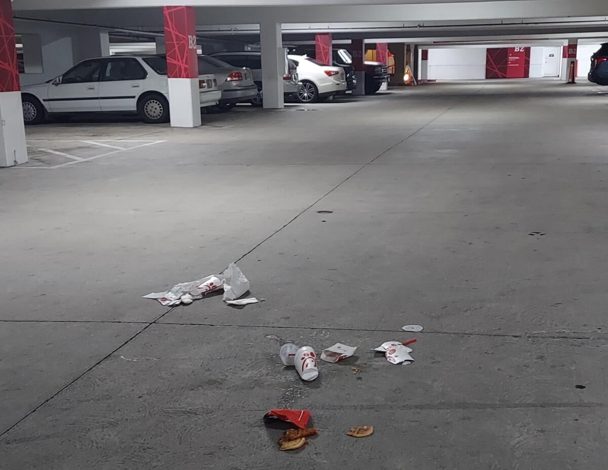 A reader noticed and later cleaned up a fast-food dinner discarded at a parking structure.