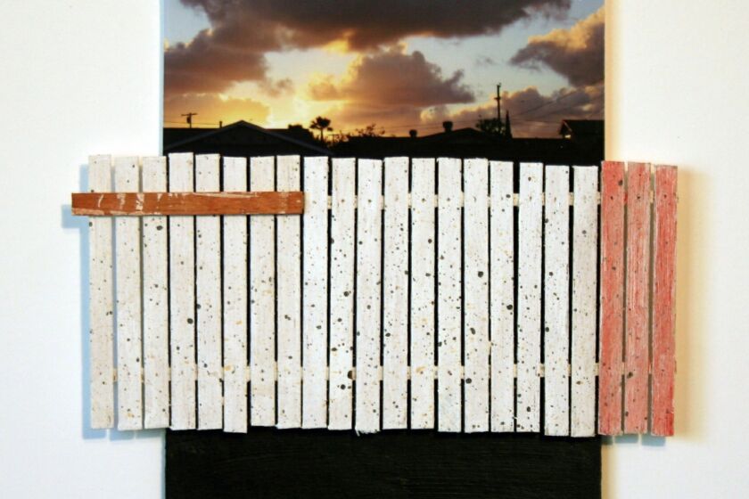 Artist Allan Morrow’s “White + 3 Red Fence — Sunset (2008)” is part of the exhibition “Painting Fences” at the Taylor LIbrary in Pacific Beach.