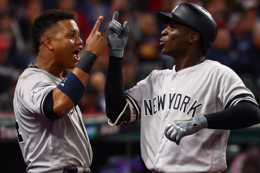 CLEVELAND, OH - OCTOBER 11: Didi Gregorius #18 of the New York Yankees celebrates his two-run homerun with Starlin Castro #14 in the third inning against the Cleveland Indians in Game Four of the American League Divisional Series at Progressive Field on October 11, 2017 in Cleveland, Ohio. (Photo by Gregory Shamus/Getty Images) ** OUTS - ELSENT, FPG, CM - OUTS * NM, PH, VA if sourced by CT, LA or MoD **
