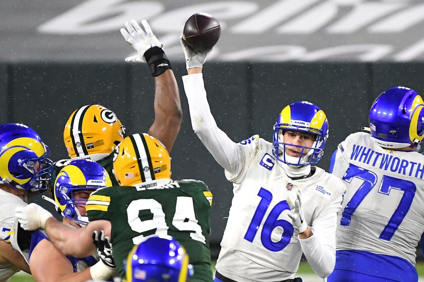 GREEN BAY, WISCONSIN JANUARY 16, 2021-Rams quarterback Jared off gets a pass off against the Packers.