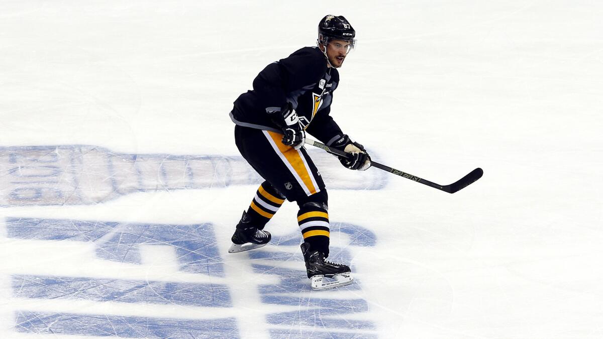 Penguins star Sidney Crosby participates in a drill during practice Sunday.