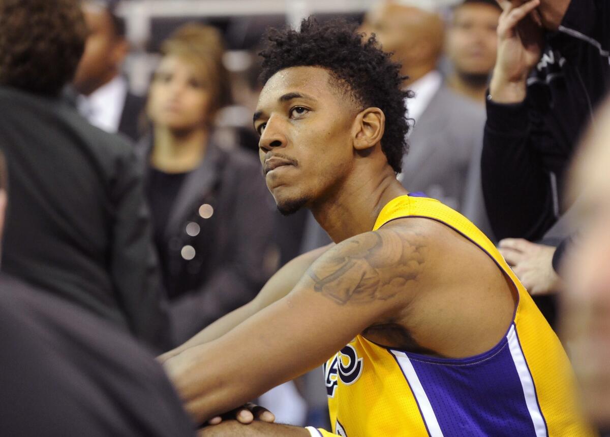 Lakers guard Nick Young looks on after fouling out during the second half of the Lakers' 105-103 loss to the Utah Jazz on Friday.
