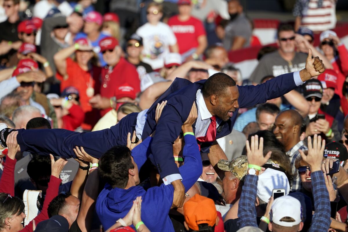 Georgia state Rep. Vernon Jones crowd surfs during a campaign rally for President Donald Trump