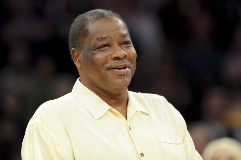 Former forward Jim McMillian is honored by the Lakers on Apr. 6, 2012. McMillian, who helped the Lakers to a 33-game winning streak and the 1972 NBA championship, died Monday, May 16.
