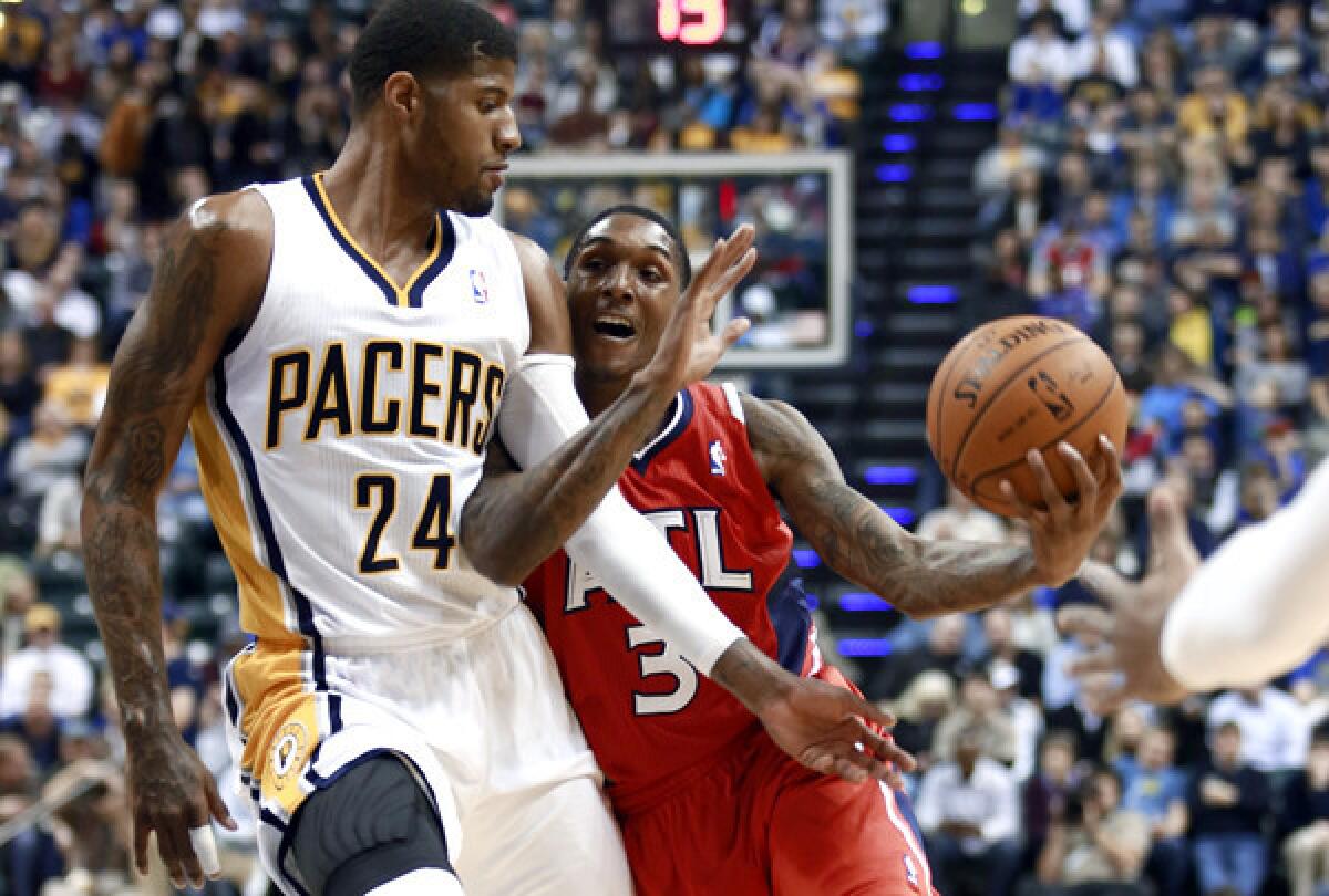 Paul George (24), fouling Hawks guard Louis Williams, and the struggling Pacers will open the Eastern Conference playoffs against eighth-seeded Atlanta.