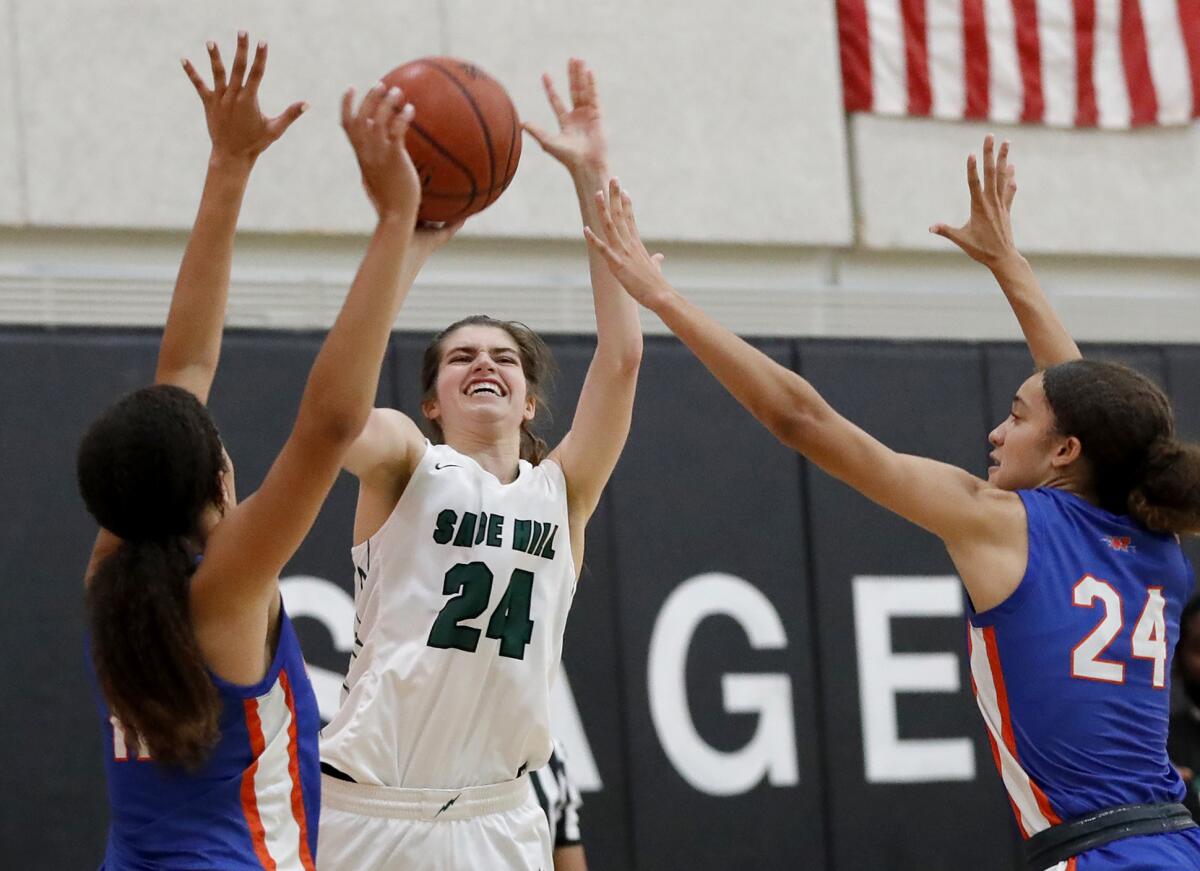 Sage Hill's Isabel Gomez (24) puts up a three-point shot in a CIF State Southern California Regional Division 2-A semifinal.