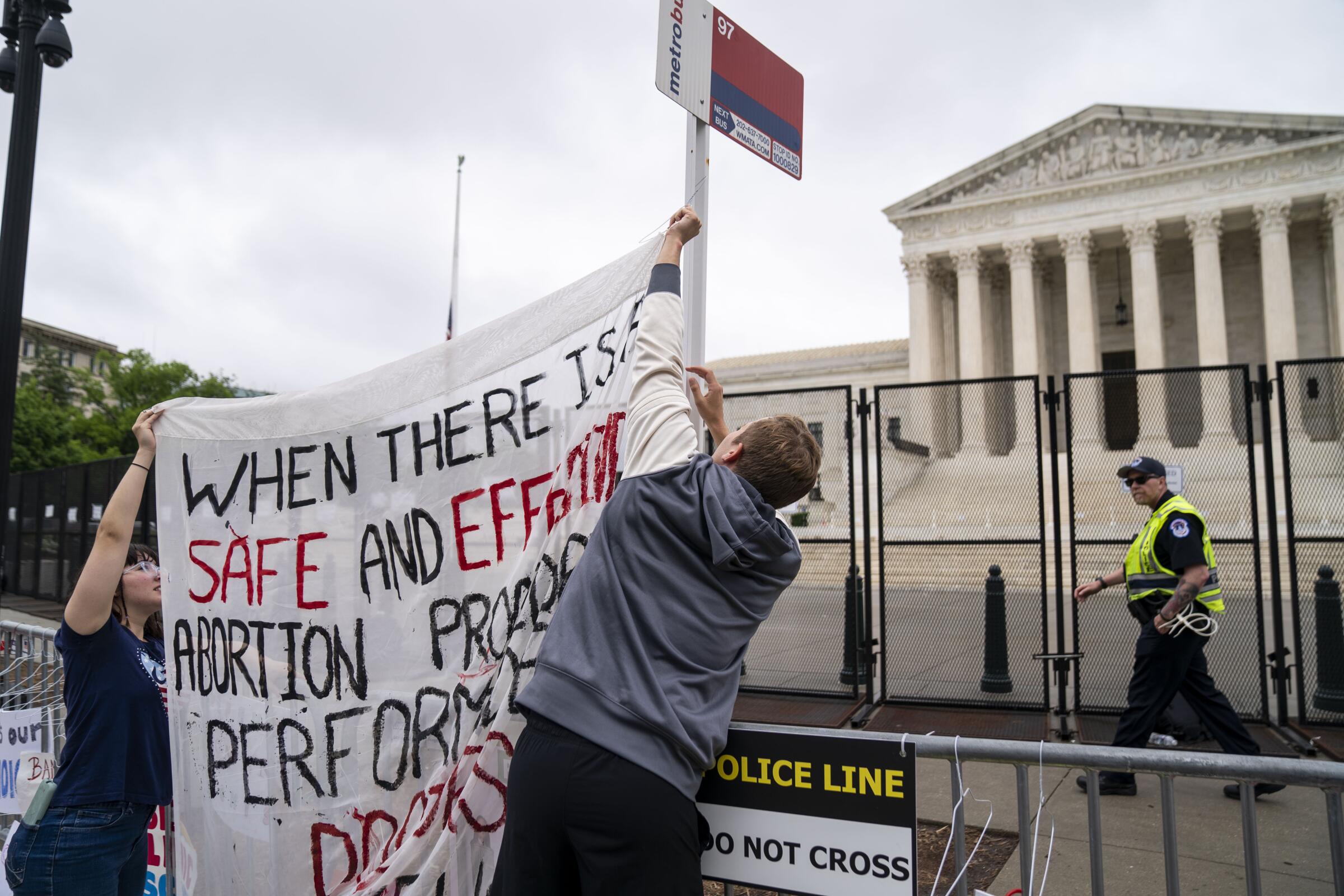 Abortion rights activists put up a banner in Washington, D.C.