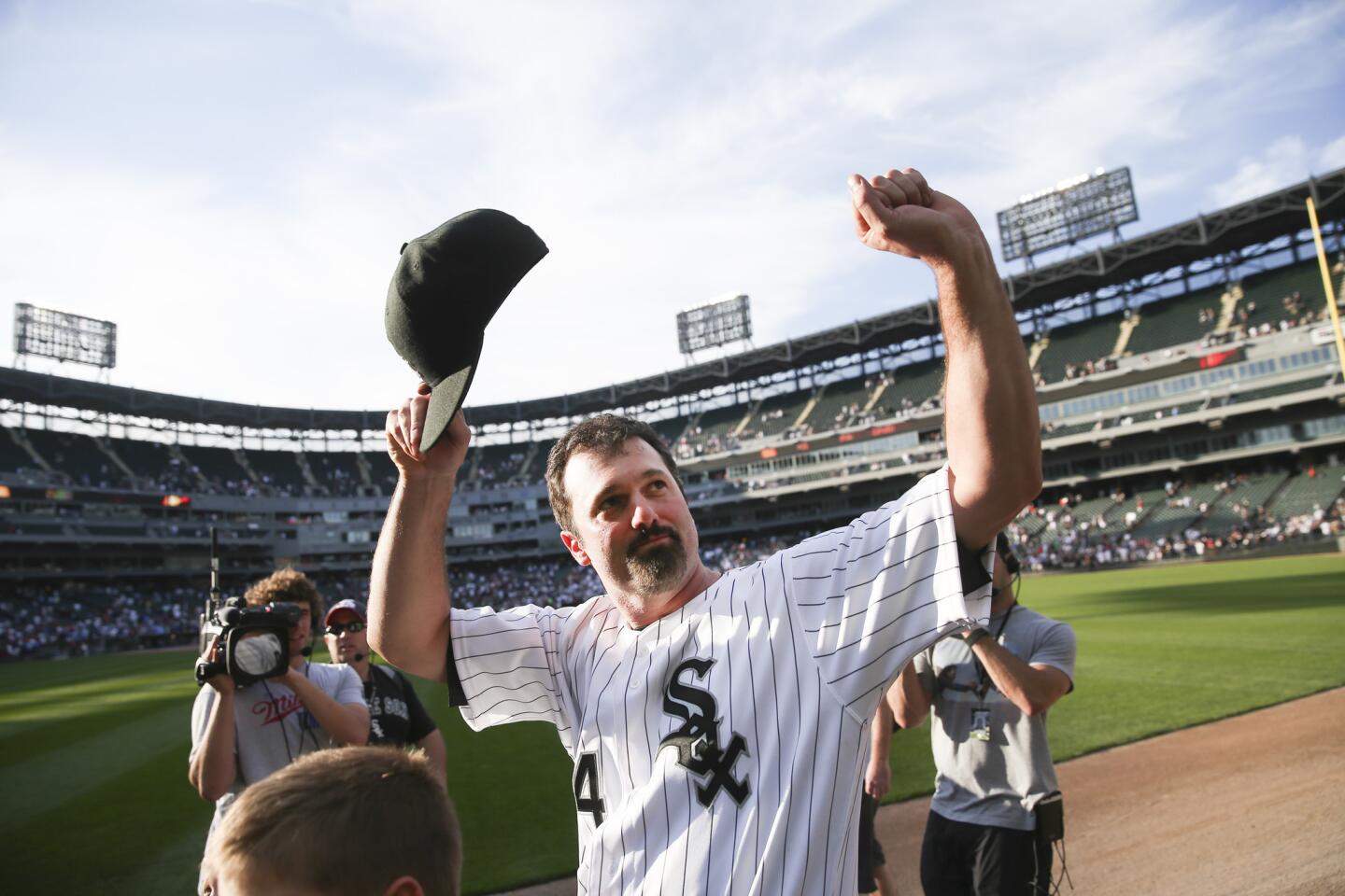 Paul Konerko takes a lap around U.S. Cellular Field after playing the final game of his career.