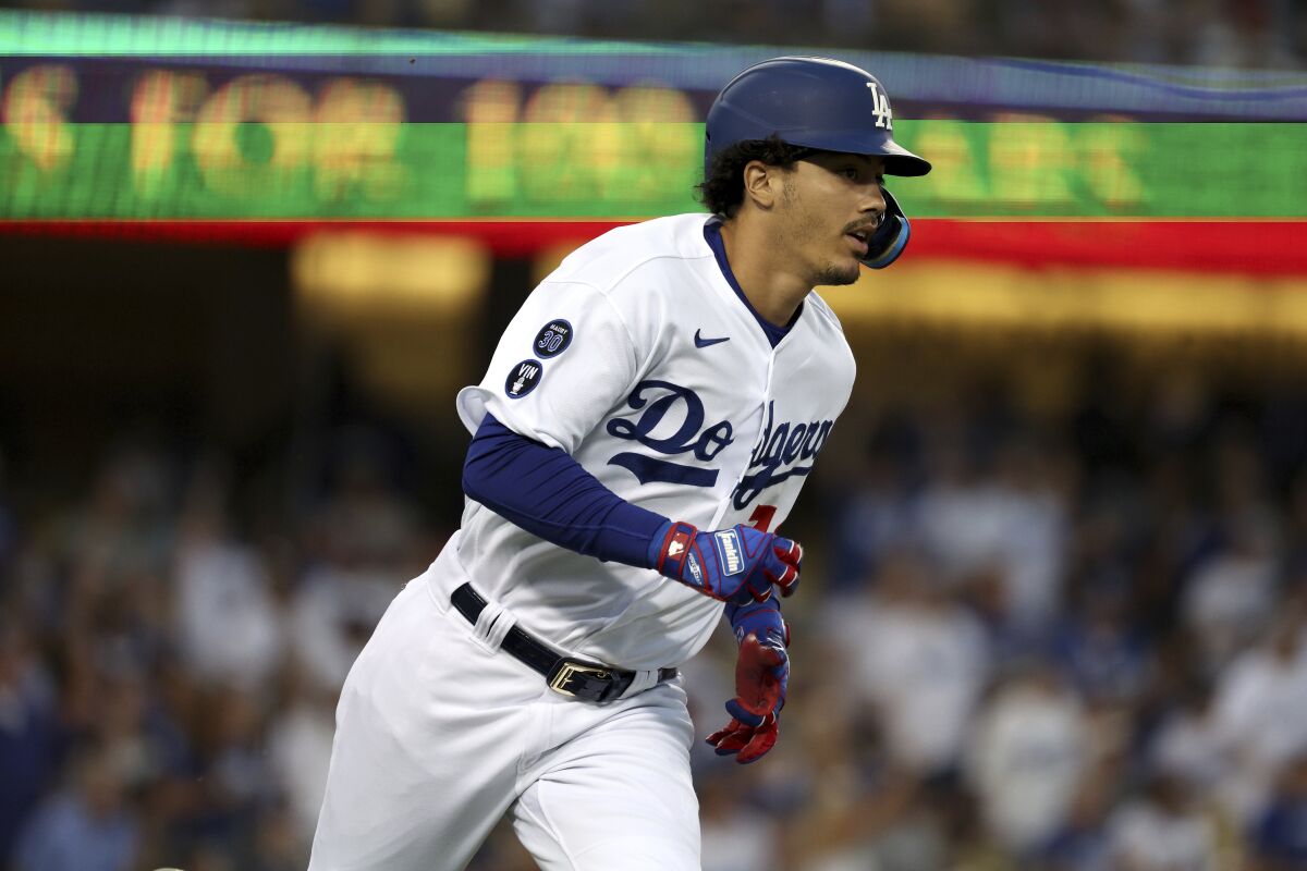 Dodgers Miguel Vargas runs the bases after hitting a two-run home run against the St. Louis Cardinals.