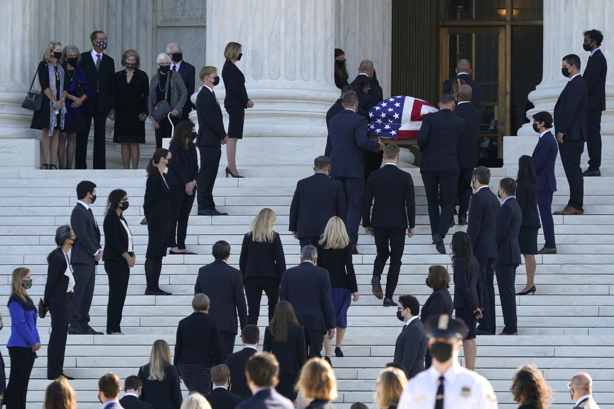 The flag-draped casket of Justice Ruth Bader Ginsburg arrives at the Supreme Court in Washington D.C.