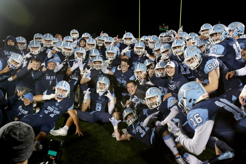 The Corona del Mar High football team plays Grace Brethren in the CIF Southern Section Division 3 title game at Newport Harbor High on Friday. PHOTO BY CHRISTINE COTTER/CONTRIBUTING PHOTOGRAPHER