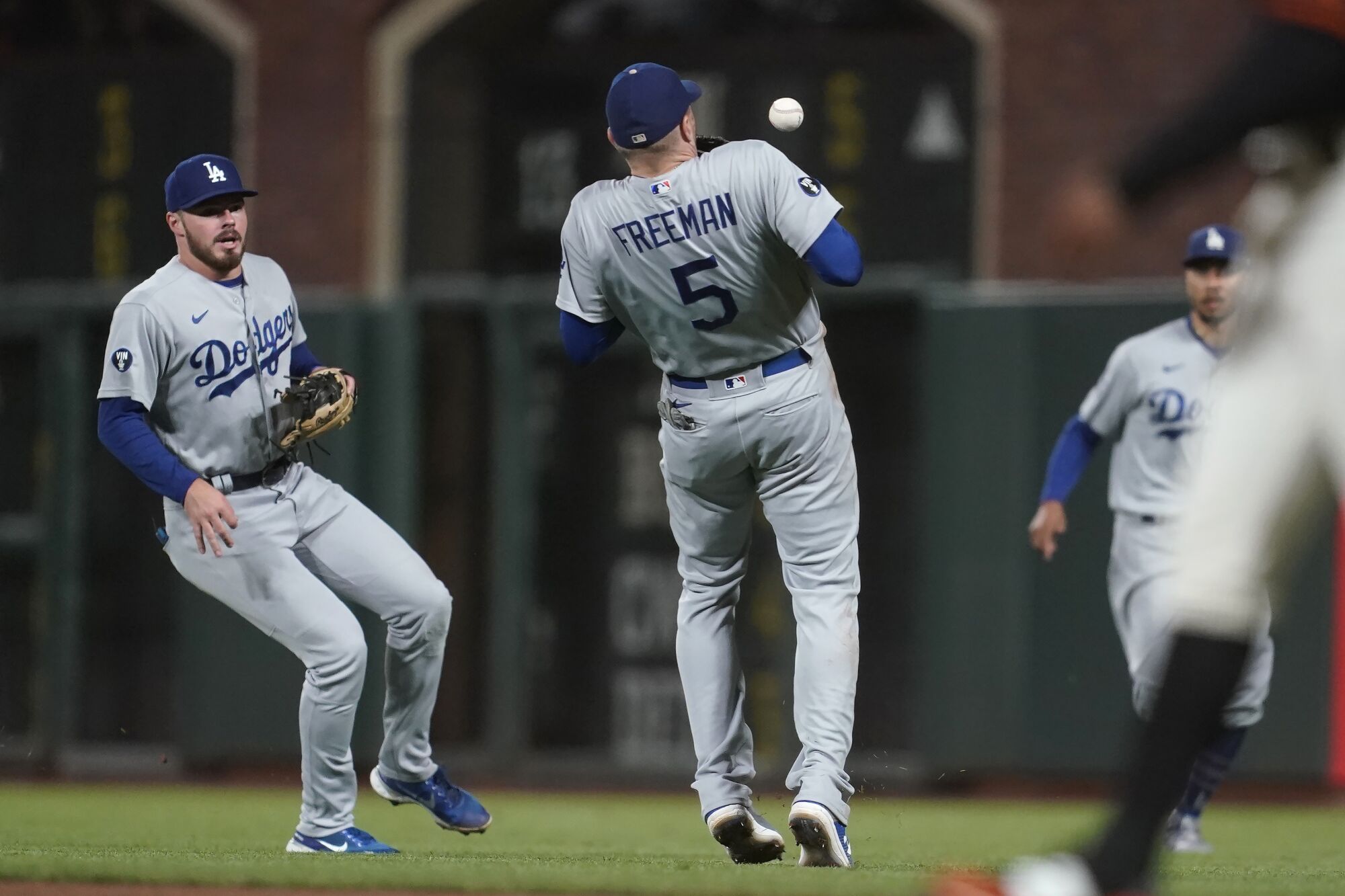 Dodgers first baseman Freddie Freeman catches a pop-up hit by the San Francisco Giants' Wilmer Flores.