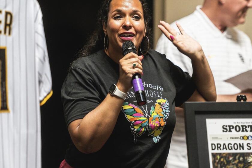 Caption: Monarch School Project President and CEO Afira DeVries speaks at the San Diego Padres’ “BaseBOWL” fundraiser benefitting the school in July 2023.