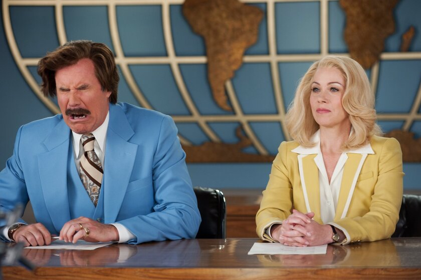 This photo provided by Paramount Pictures shows Will Ferrell, left, as Ron Burgundy and Christina Applegate as Veronica Corningstone, in a scene from the film, "Anchorman 2: The Legend Continues." 