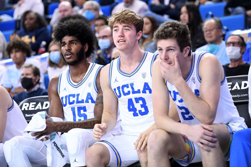 UCLA's Russell Stong cheers from the bench during a game against Northern Florida at Pauley Pavilion.