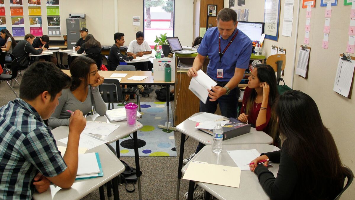 SAN DIEGO, CA Sept. 7th, 2016 | In a Personalized Learning Academy classroom at Vista High School, teacher Jeb Dickerson (standing) works with students in a history class in Vista, California. Vista High School won $10 million in a national competition...