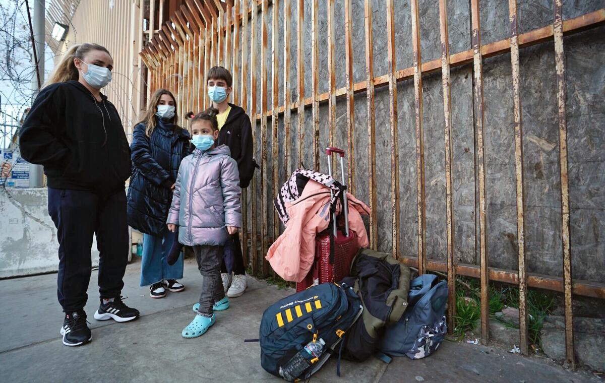 A Ukrainian family waits to enter the United States on March 8.