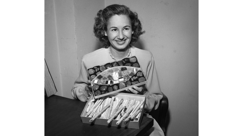 a woman holds an open box