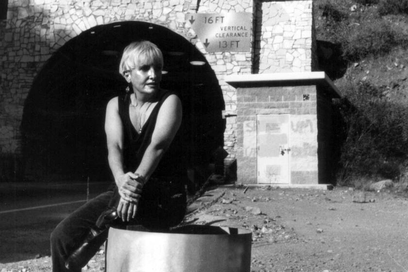 A 1991 photo of artist Lynne Westmore Bloom at the tunnel in Malibu, where she painted the "Pink Lady," a piece of guerrilla public art, in 1966.