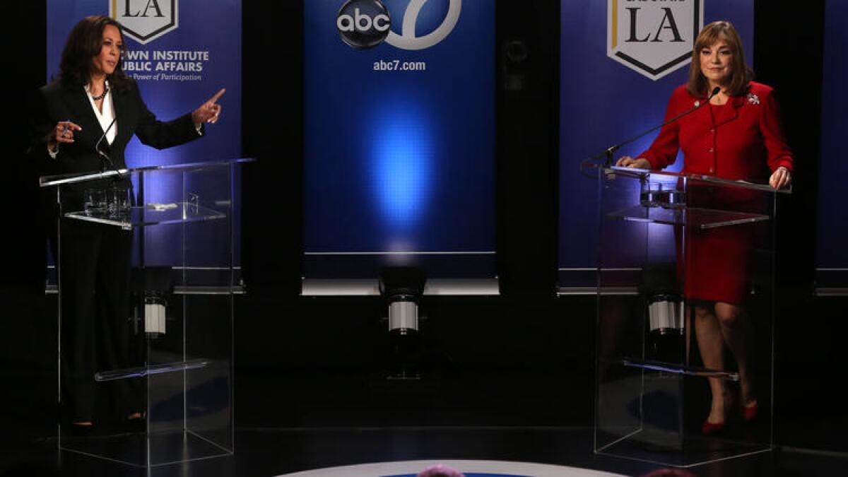 Senate candidate Kamala Harris, left, points a finger toward rival Loretta Sanchez during their debate at Cal State L.A. on Oct. 5.