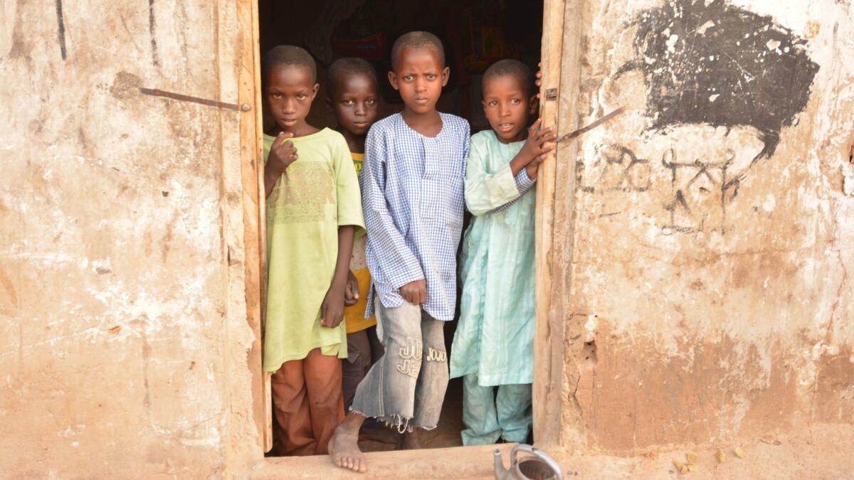 Children living in one of the Maiduguri, Nigeria, neighborhoods where Garba Buzu offers houses to families rent-free.