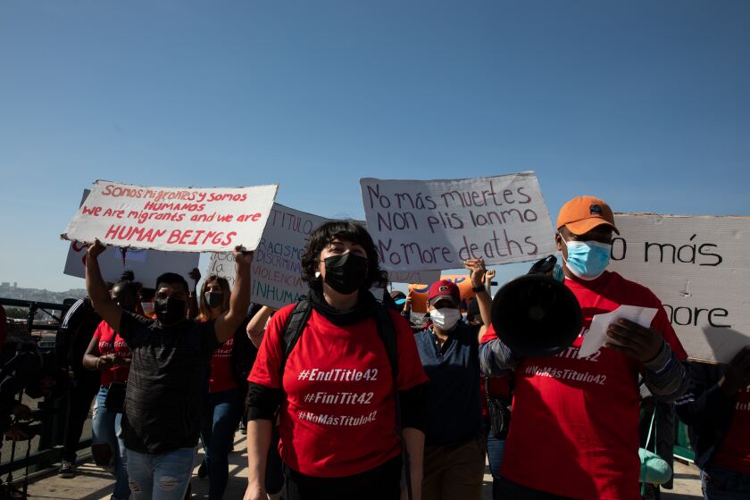 Tijuana, Baja California - March 21:A group asylum seekers and advocates walk to San Ysidro Pedestrian East Port of Entry in protest of Title 42 on Monday, March 21, 2022 in Tijuana, Baja California. (Ana Ramirez / The San Diego Union-Tribune)