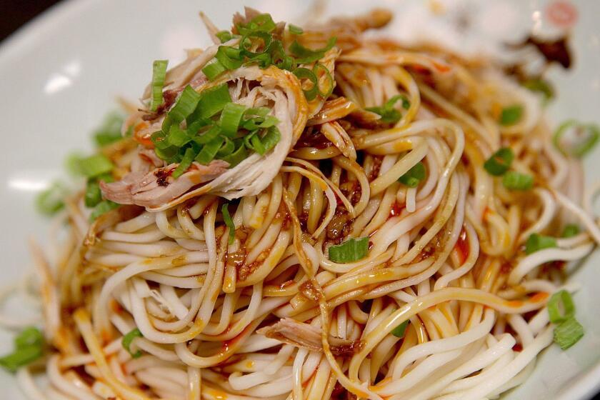 MONTRERY PARK, CA., AUGUST 20, 2018--Tiantian Qiu, the chef at Hip Hot, a Sichuan restaurant in Monterey Park. The dish is a cold Sichuan noodles. (Kirk McKoy / Los Angeles Times)