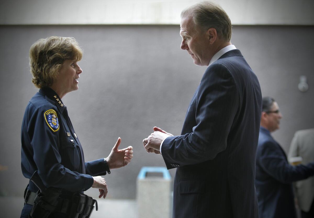 San Diego Police Chief Shelley Zimmerman, left, talks with San Diego Mayor Kevin Faulconer, at the Community Concourse.