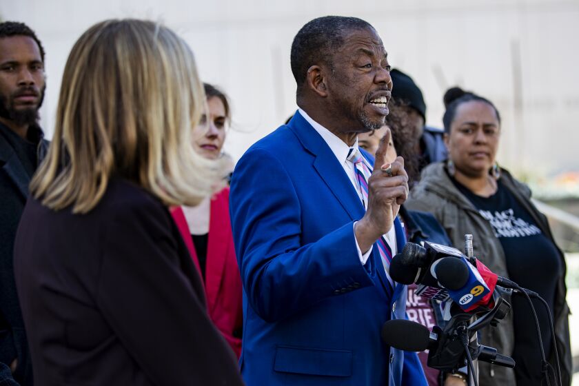 Attorney Carl Douglas announces the filing of a federal lawsuit against the LAPD on behalf of Melina Abdullah