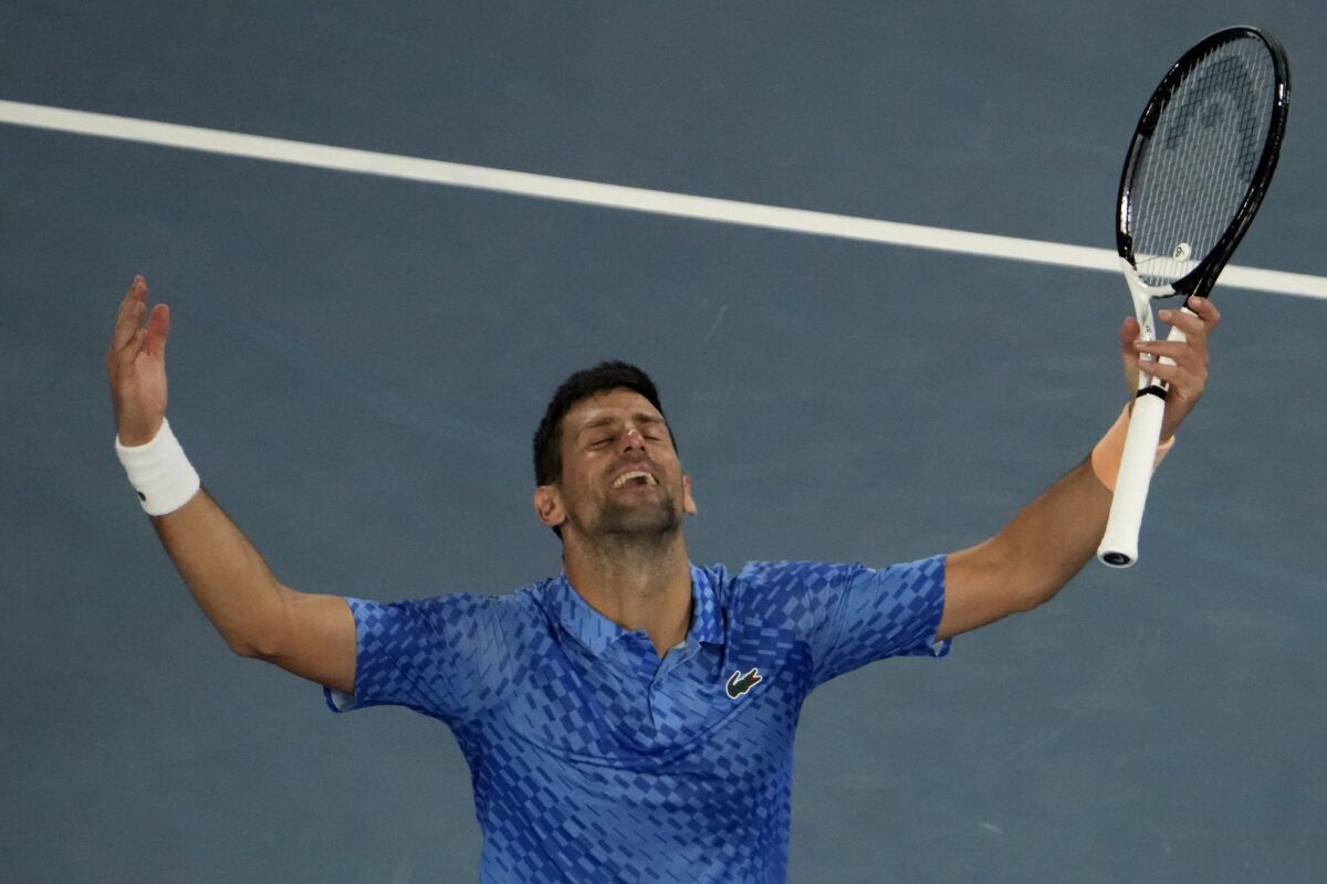 Novak Djokovic of Serbia celebrates after defeating Stefanos Tsitsipas of Greece in the men's singles final at the Australian Open tennis championships in Melbourne, Australia, Sunday, Jan. 29, 2023. (AP Photo/Ng Han Guan)