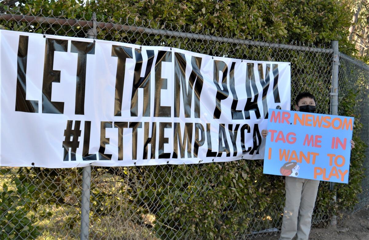 Participants at the Let Them Play Rally last month had a number of signs and banners.