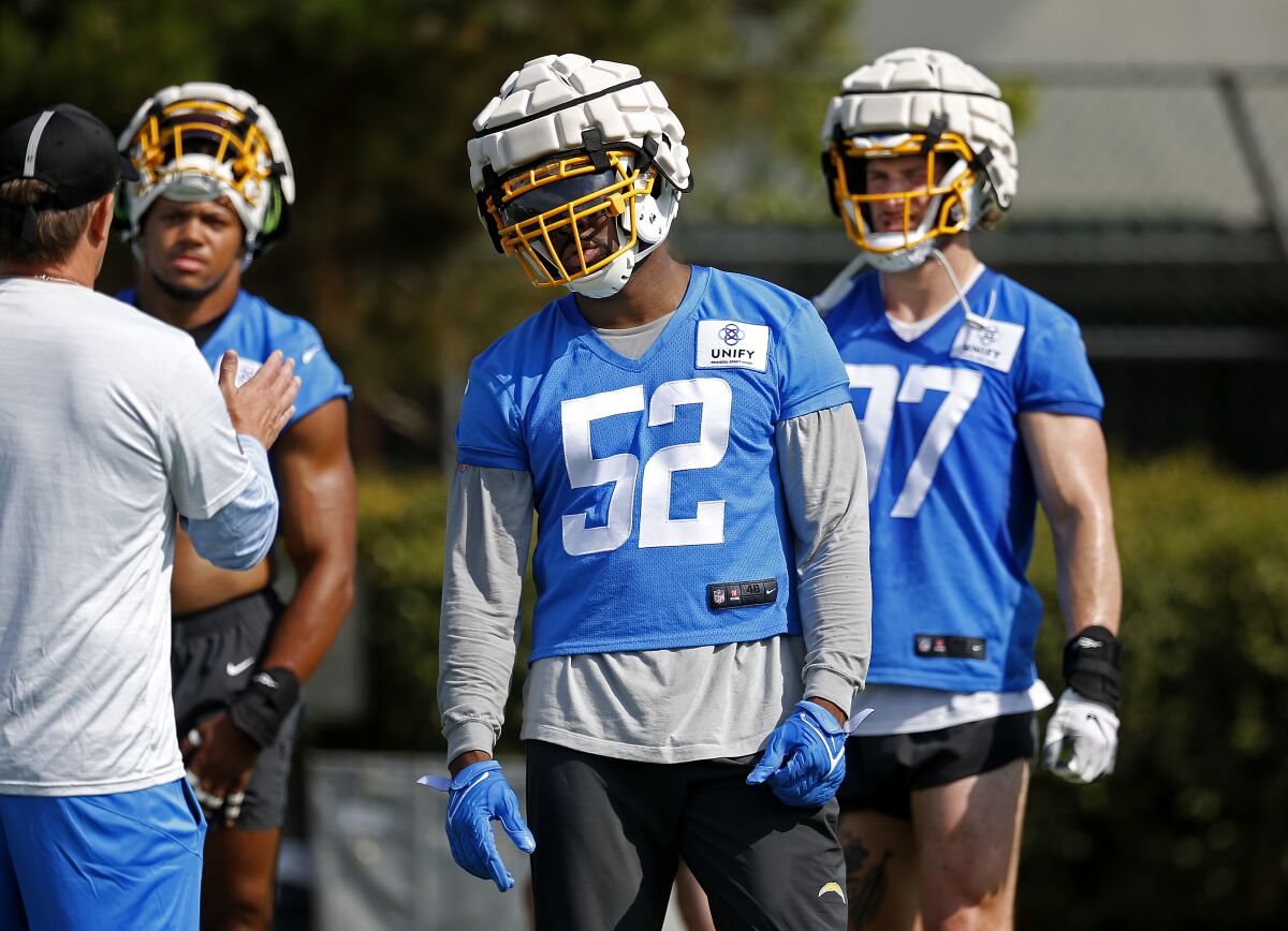 Chargers linebacker Khalil Mack (52) stands on the field before a drill at practice Thursday.