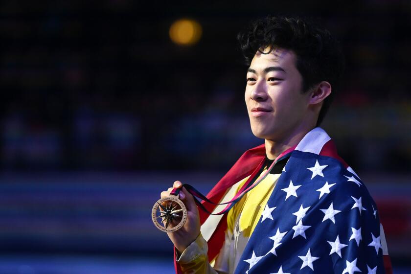Winner USA's Nathan Chen poses with his medal and the US flag after the Men Free Skating program on December 7, 2019 at the ISU Grand Prix of figure skating Final 2019 in Turin. (Photo by Marco BERTORELLO / AFP) (Photo by MARCO BERTORELLO/AFP via Getty Images)