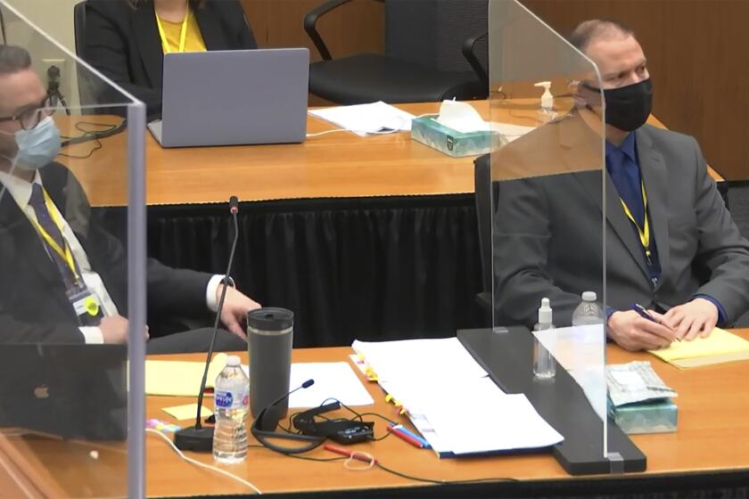 In this image taken from video, defense attorney Eric Nelson, left, and defendant former Minneapolis police officer Derek Chauvin listen as Hennepin County Judge Peter Cahill presides over jury selection, Wednesday, March 10, 2021, at the Hennepin County Courthouse in Minneapolis, Minn., in the trial of Chauvin, who is accused in the May 25, 2020, death of George Floyd. (Court TV/Pool via AP)
